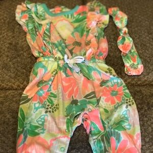 Baby girl jumpsuit with matching headband.